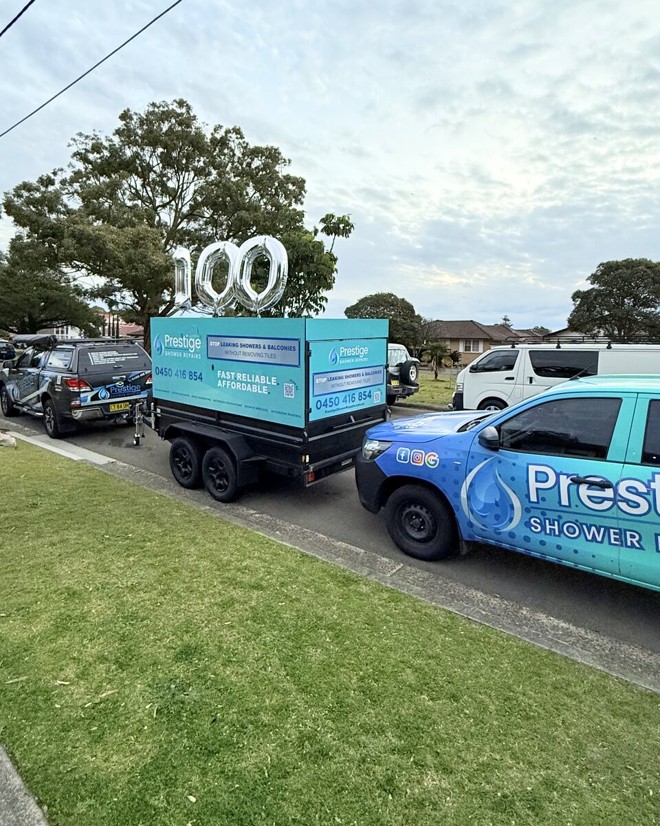 Prestige Shower Repairs utes and service trailer